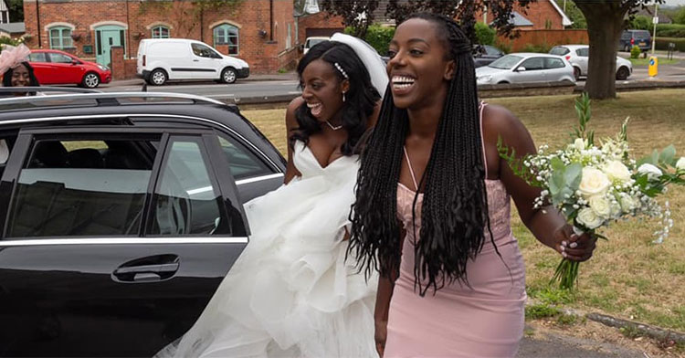 bride and bridesmaid on side of road