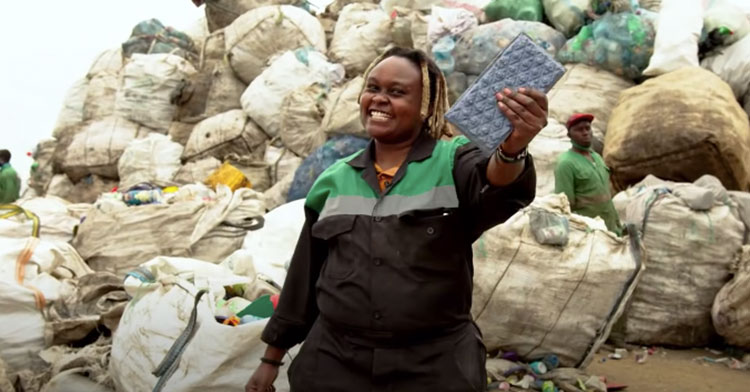 woman holding up plastic brick