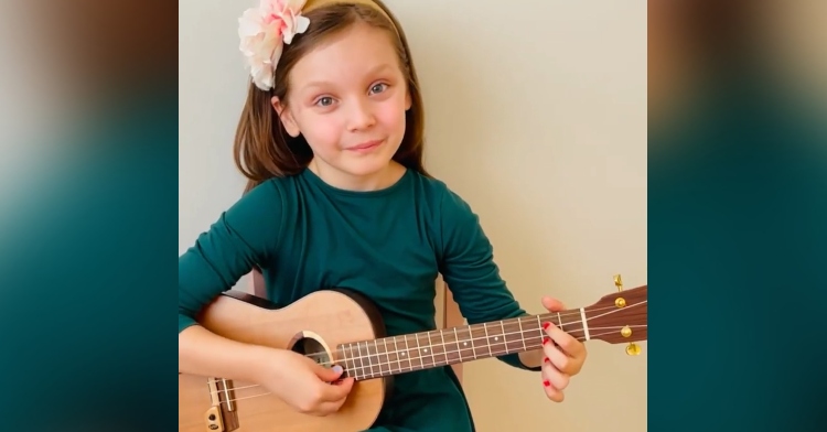 8-year-old playing ukulele