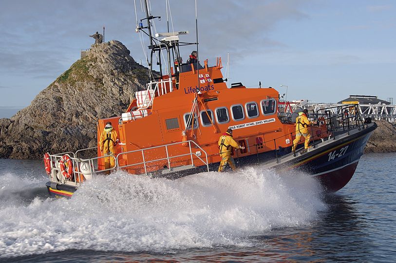 rescue crew on orange Lifeboat
