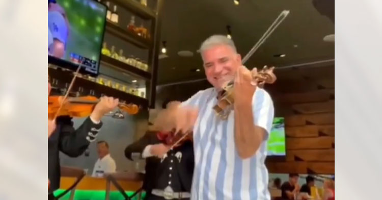 dad playing in restaurant mariachi band