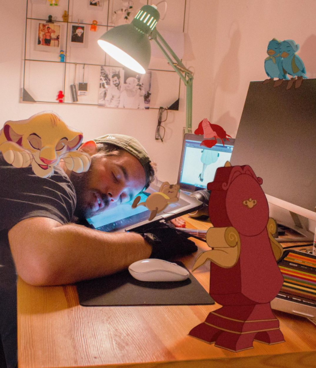 man sleeping at his desk on top of his tablet with photoshop versions of disney characters around him
