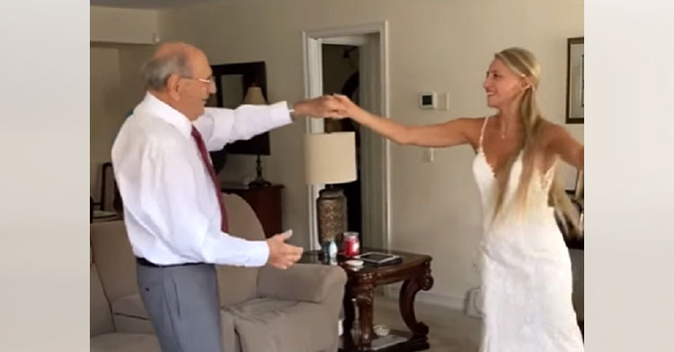 grandpa dancing with bride in living room
