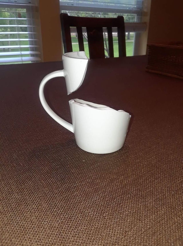 a broken mug that is still standing up