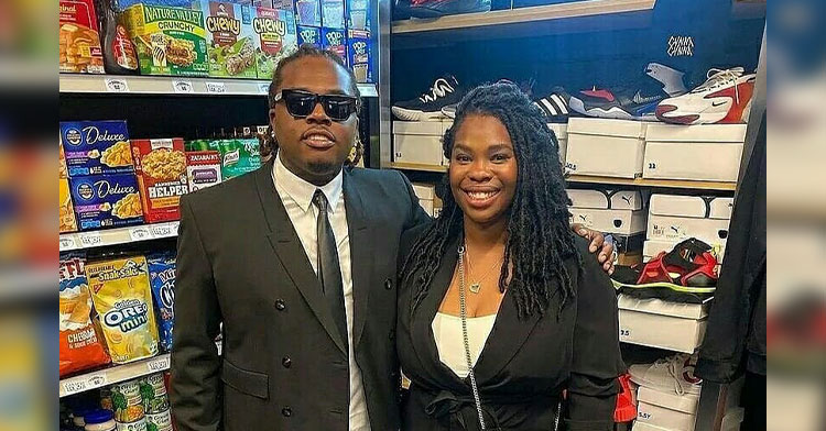 man and woman smiling in grocery store