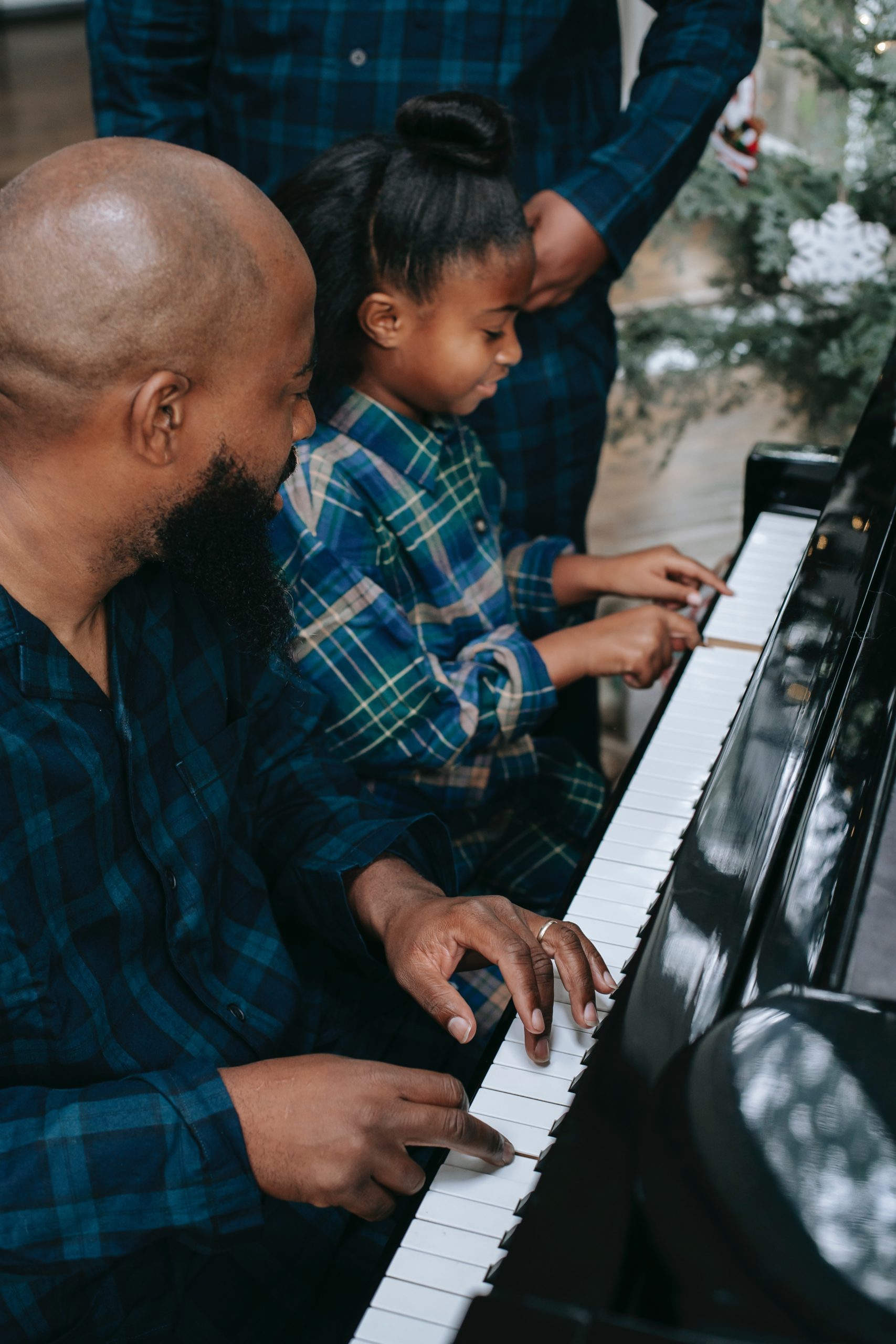 dad with daughter at piano