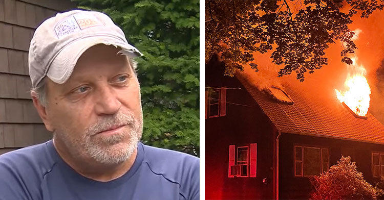 man standing in yard next to house on fire