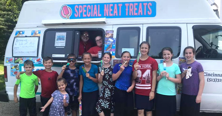 kids gathered around ice cream truck