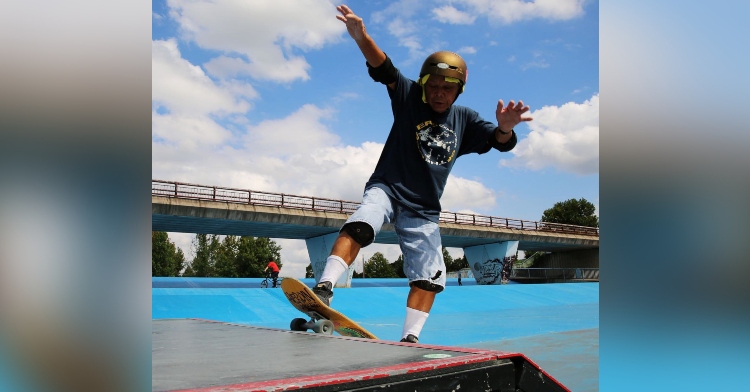 oldest skateboarder in the world, yoshio kinoshita, skateboarding on a ramp while wearing a helmet