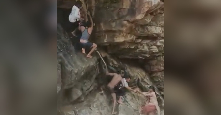 rescuers save woman and child from waterfall in India