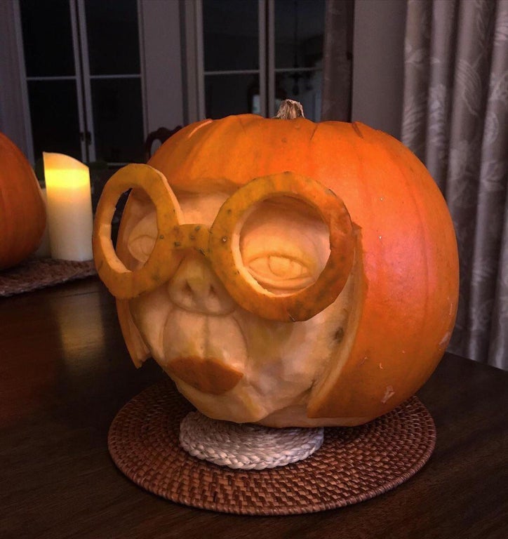 pumpkin carved to look like edna mode from the movie the incredibles 