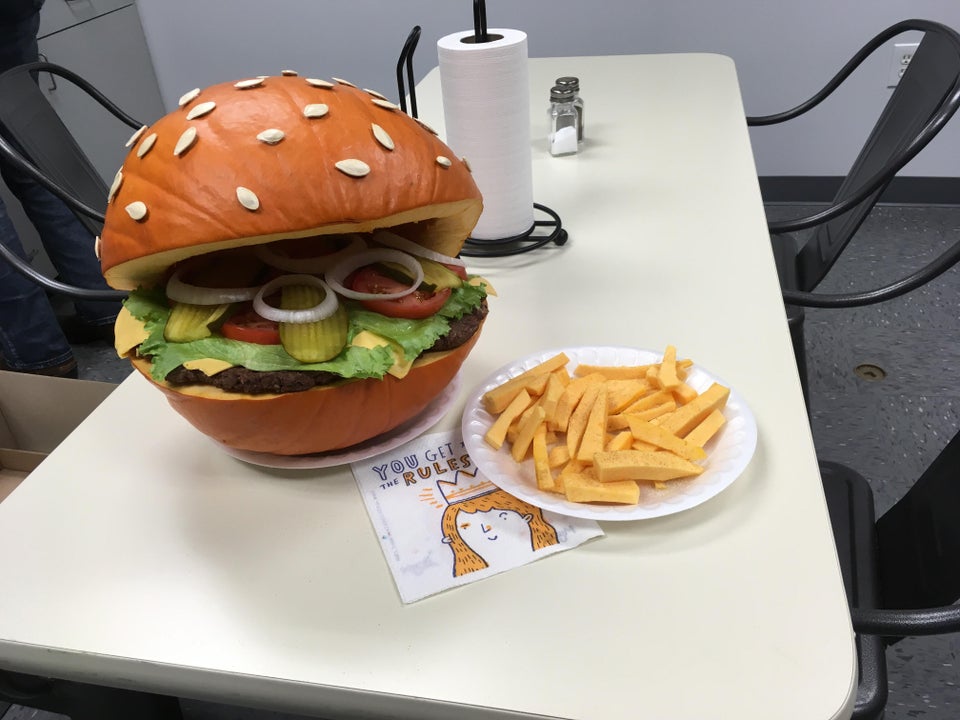 carved pumpkin made to look like a cheeseburger with fries 