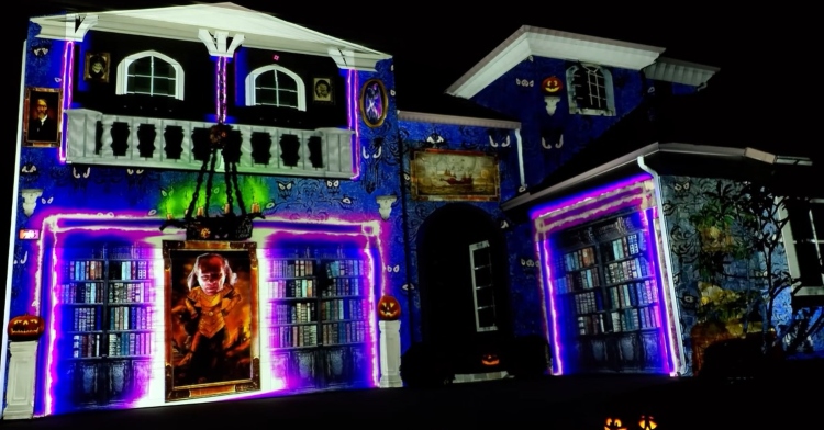 colorful ghostbusters projection show on the side of a house