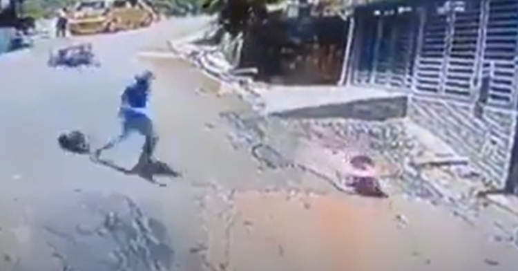 man running down hill after a baby rolling away in a walker