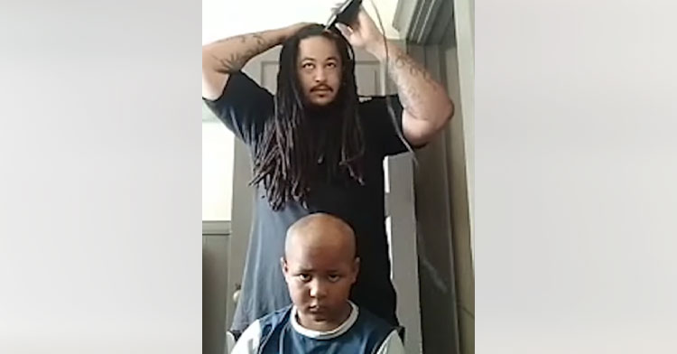 dad with long hair shaving head next to son with cancer