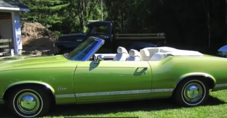 classic green Oldsmobile convertible car