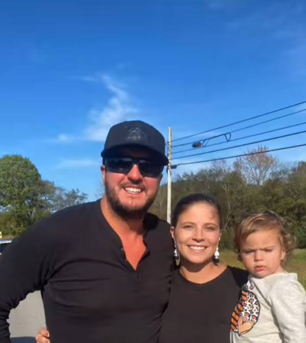 Luke Bryan poses for a picture with Courtney Potts and her child.