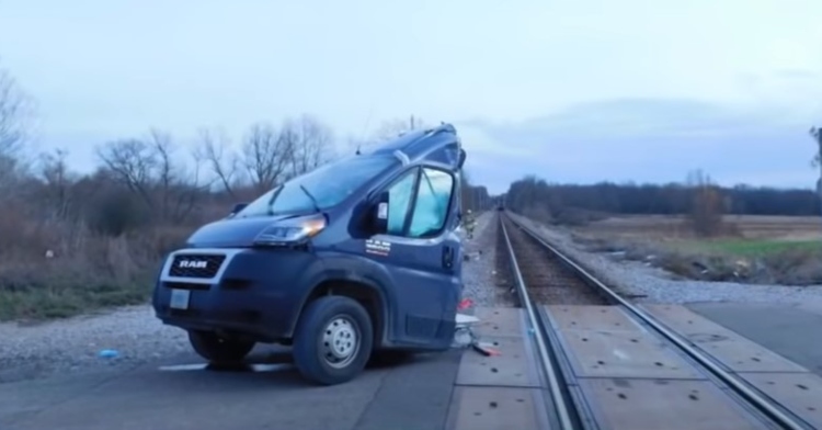 the front half of an amazon delivery truck that was cut in half by a train