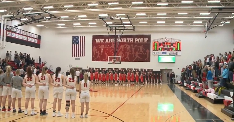 high school basketball crowd sings national anthem
