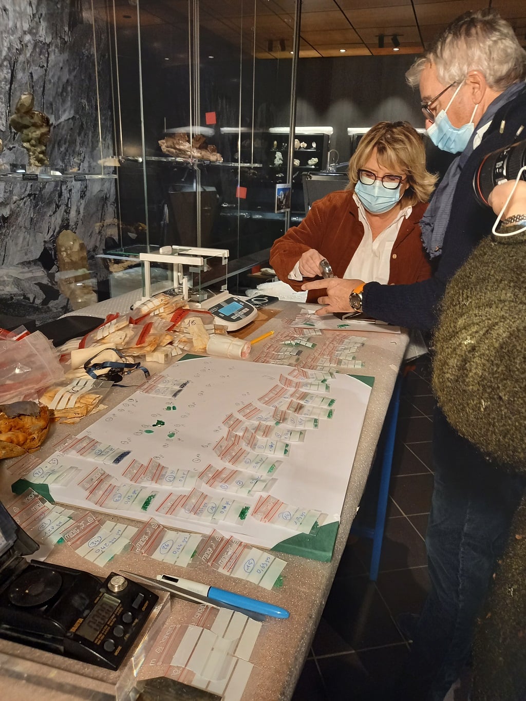 group of people inspecting precious gems that were discovered in the mountain mont blanc
