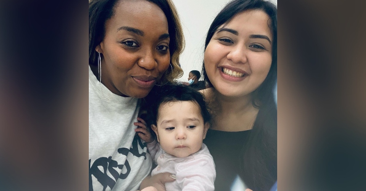 a woman named rita williams and a woman named jazmine castillo smiling and posing with jazmine's baby