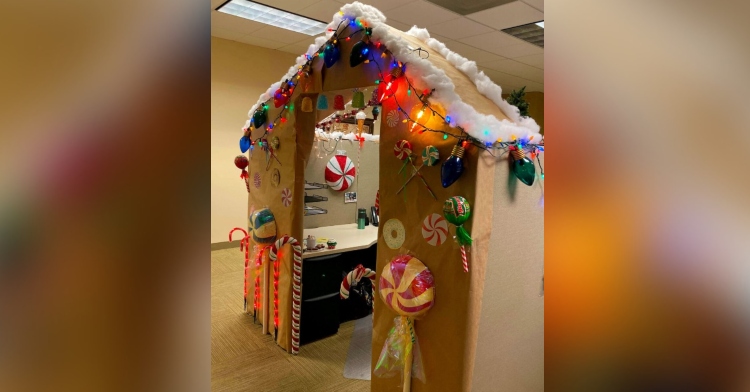cubicle decorated to look like a giant gingerbread house that was created by a woman named monika orrey