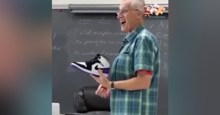 man named mr. dunton looking shocked with excitement as he holds a new pair of air jordans his students gifted him