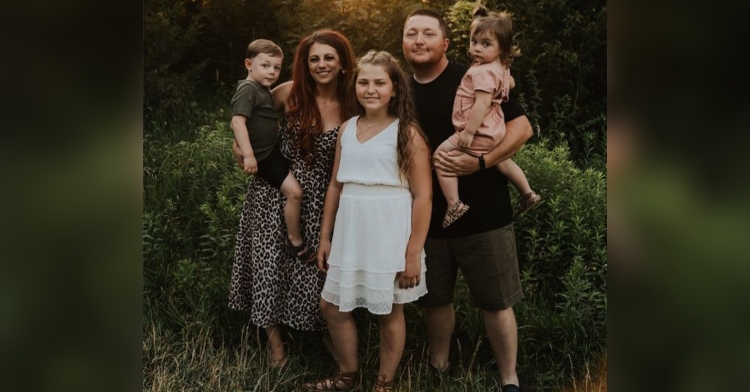 a woman named brittany berrie, a man named branden johnson, and their three kids, including 11 year old gracie, smiling and posing outside