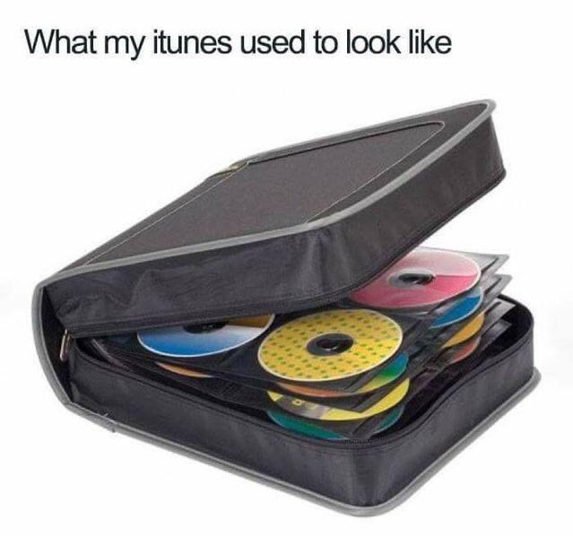 meme of a leather book full of CDs that says "What my itunes used to look like"