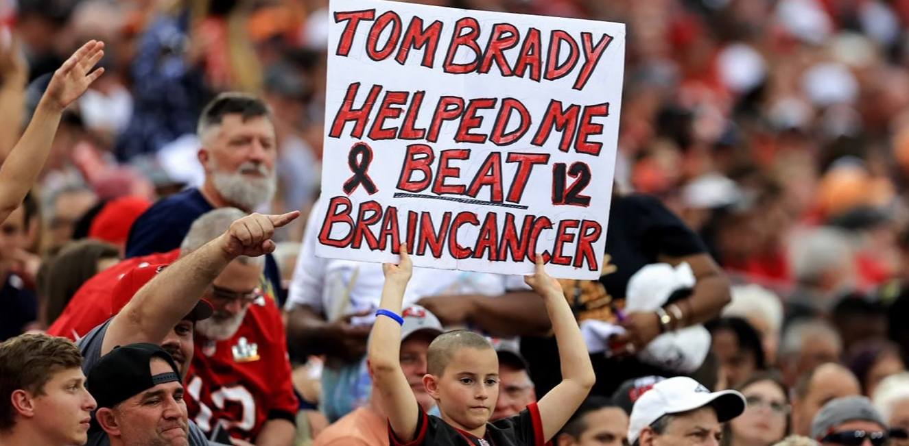 Noah Reeb's Tom Brady sign that reads 