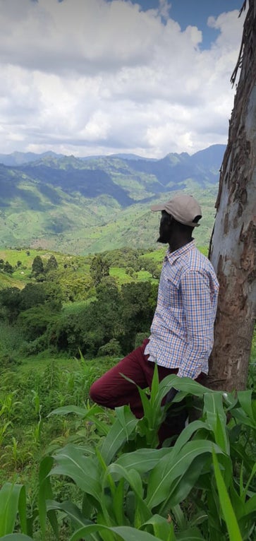 Young man looking over an outlook in Kenya