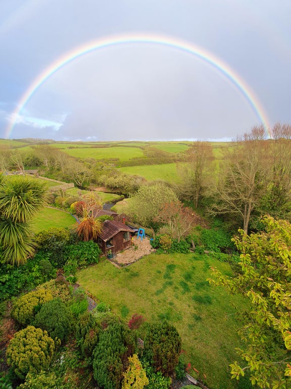 Cornwall England with a rainbow over a cottage