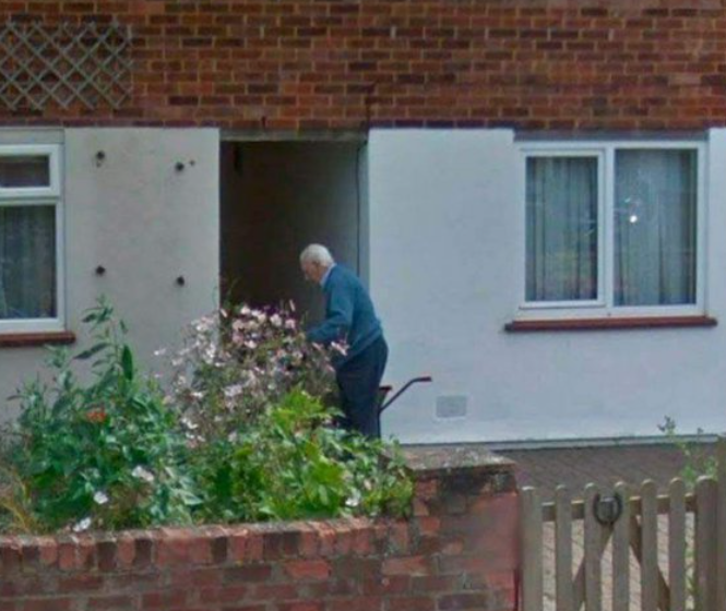screenshot from google maps of an elderly man gardening outside of his home
