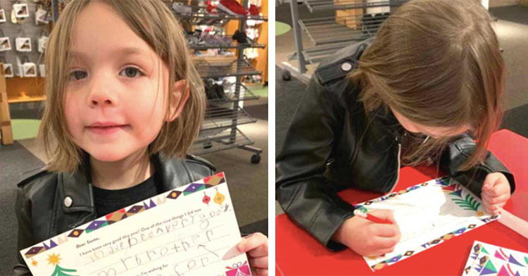 little girl holding letter to santa