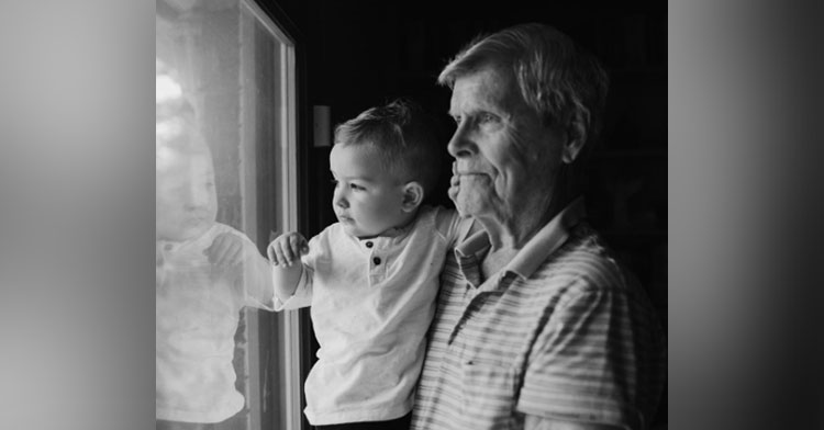 grandpa with dementia holding grandson
