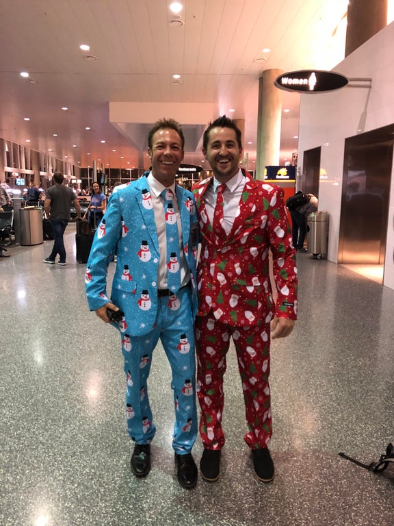two men in Christmas suits