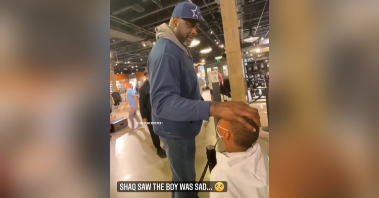 shaquille o'neal placing his hand on a little boy named zions head as he talks to him in the checkout line of a store