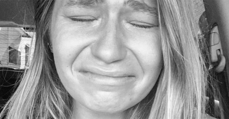 black and white photo of woman crying