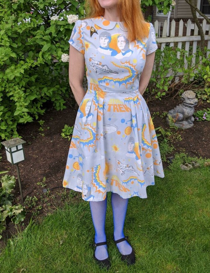 a woman wearing a dress she made from a vintage bedsheet