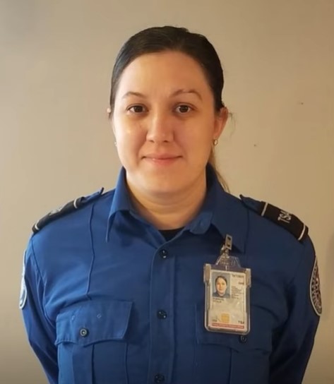 tsa agent named cecilia morales smiling and posing for a photo while in uniform 