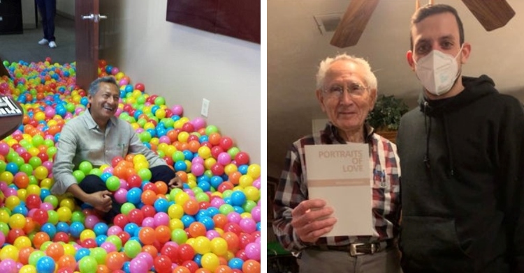 man laughing and smiling as he sits in a giant ball pit in his office at work and a man wearing a face mask posing with an elderly co-worker who is holding his book "portraits of love" in one hand and with the other hand is making "bunny ears" behind the other man's head