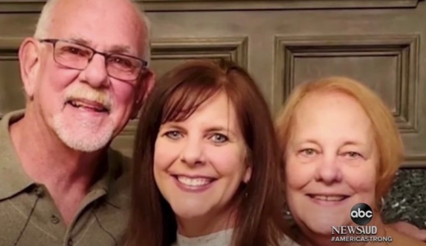 man named cougill smiling and posing with his daughter, laura mabry, and his wife, donna horn
