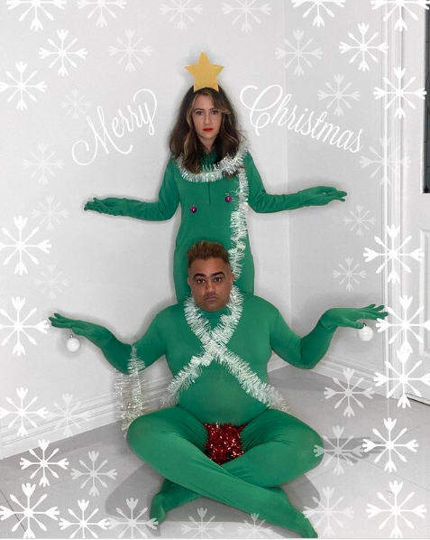 couple dressed as awkward christmas tree