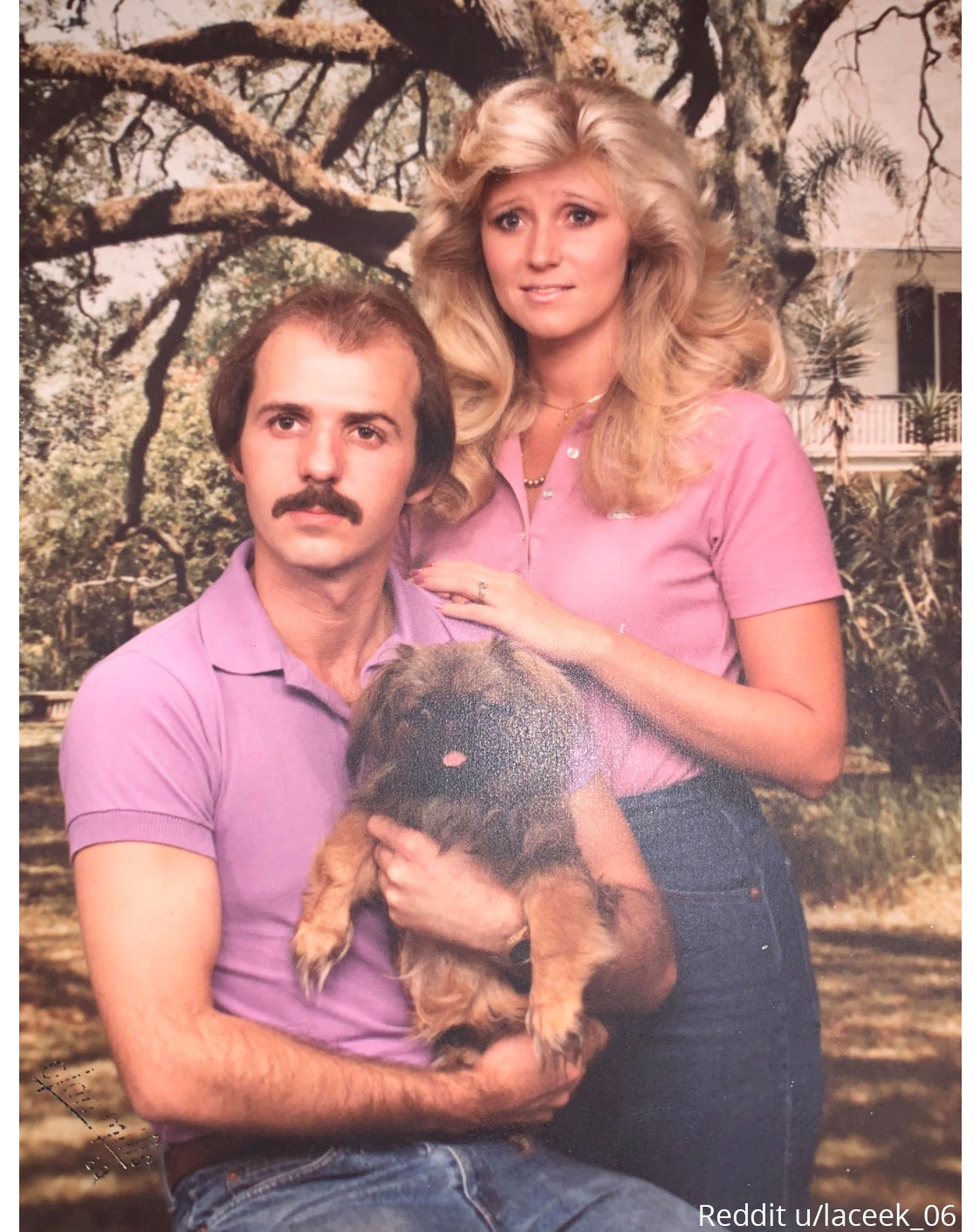 80's couple holding a dog with crazy eyes