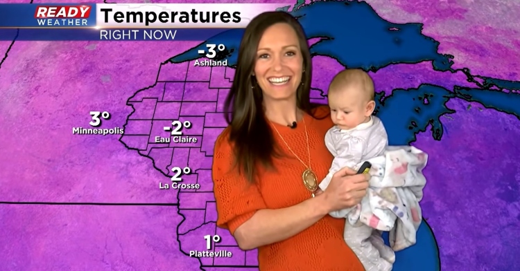 meteorologist rebecca schuld smiling as she holds her 13-week-old baby, fiona, while giving the weather report for milwaukee, wisconsin.