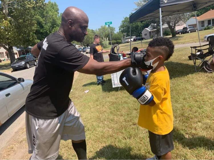 Tracy boxing with child