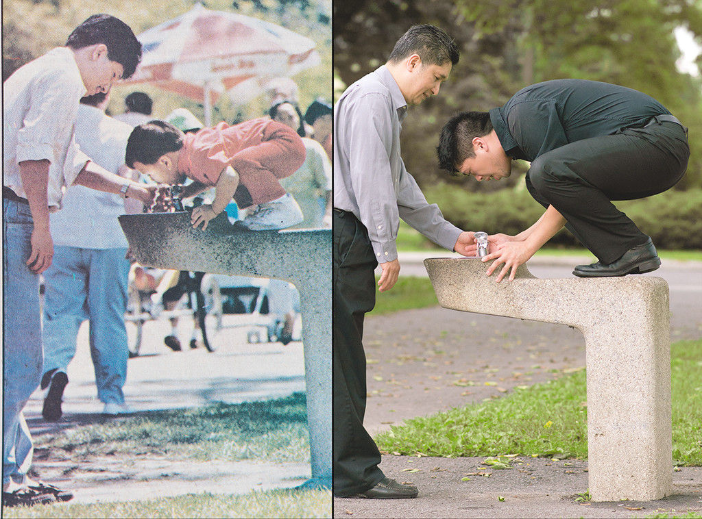 a photo of a man helping his little boy drink from the water fountain while his son stands on the fountain and those same people recreating that photo when the son is now an adult