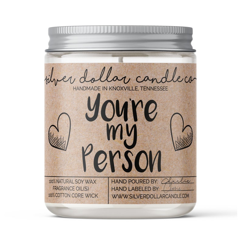 a natural soy wax candle with the lable 