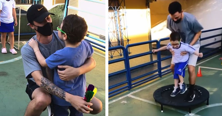 a man named gean sampaio wearing a face mask as squats outside on a playground and hugs a disabled student named heitor in brazil