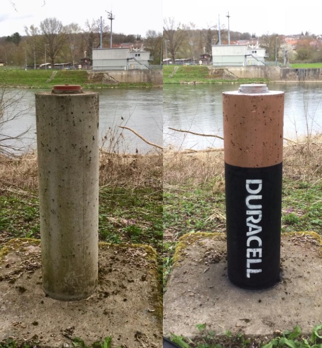 graffiti art by jps of a post made to look like a duracell battery